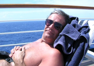 husband enjoying the sun on a cruise ship